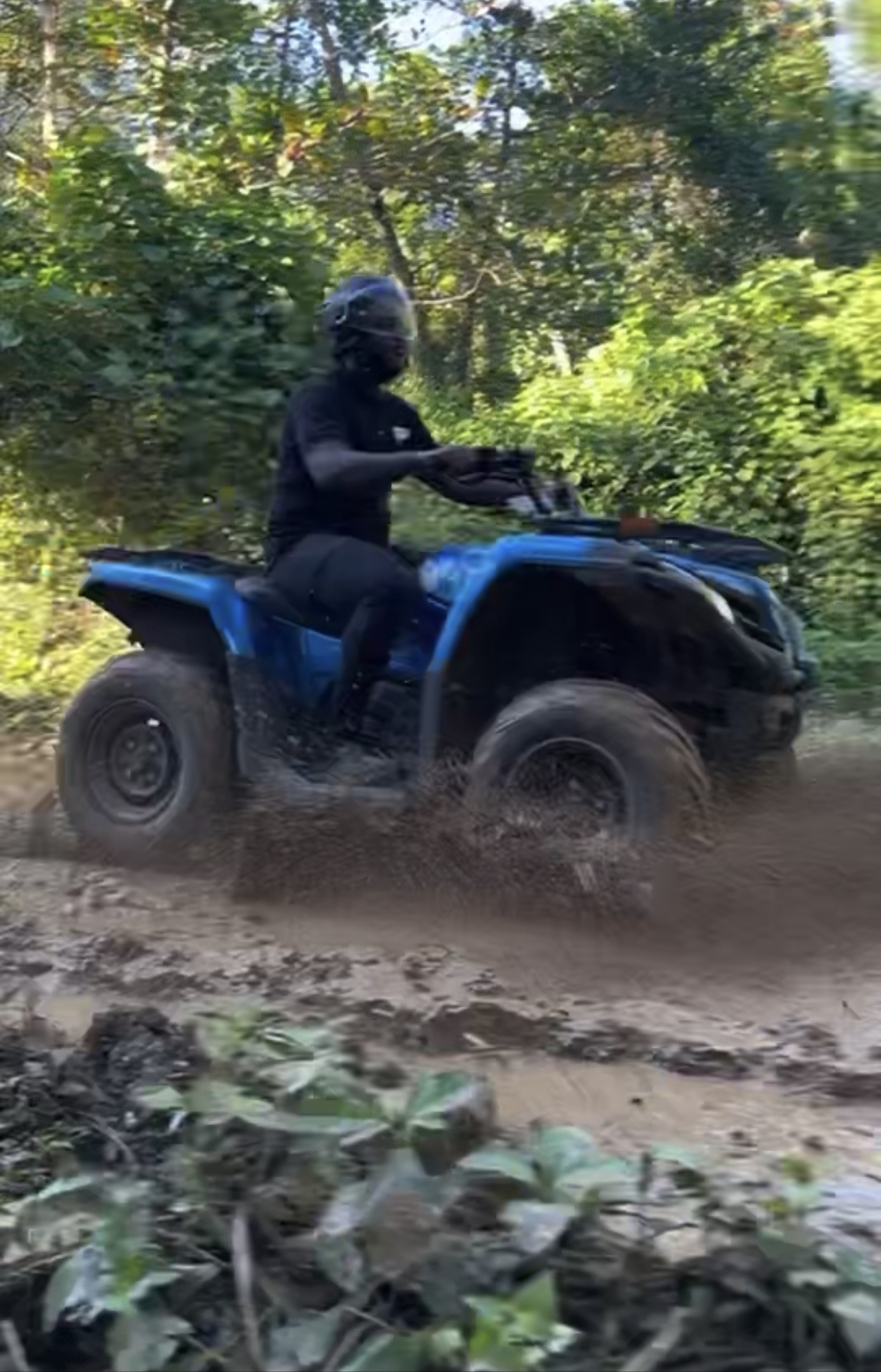 ATV rider on the wooded trails at Camp Irie Adventures